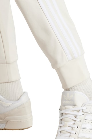 Trainingsbroek Slim Adicolor Classics - Ivoorkleurig