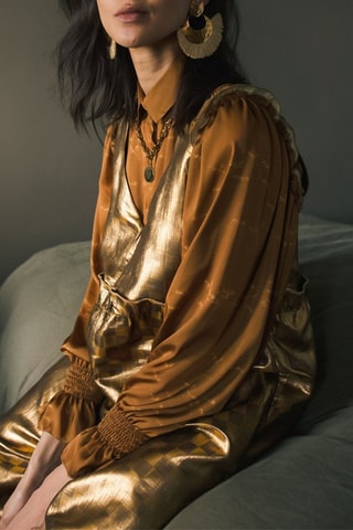 Macacão 
Dourado