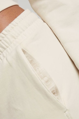 Calças de treino tapered em algodão biológico Tape - Branco