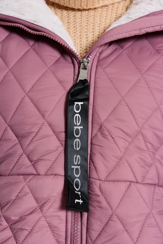 Lange gewatteerde jas met capuchon - Roze