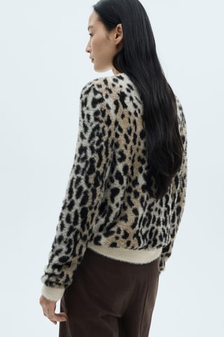 Pull-over fausse fourrure en imprimé animal - Noir