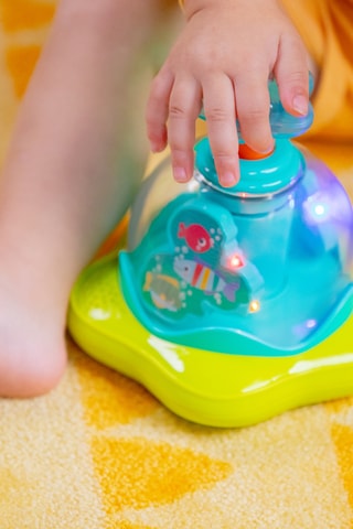 Jouet musical Press & Glow Spinner - Dès 6 mois
