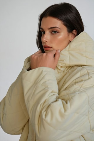 Lange gewatteerde jas met capuchon - Beige