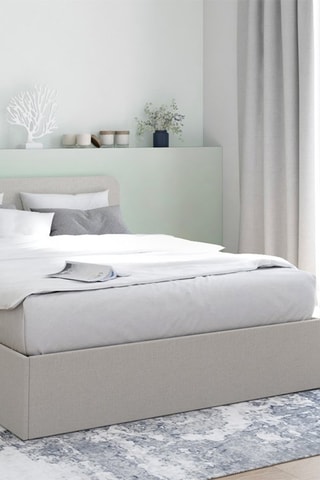 Lit coffre Louise en tissu beige avec sommier et tête de lit arrondie 140x190cm