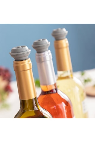 Tire-bouchon à pompe et 4 bouchons de vin