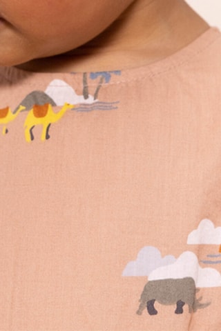 Combinaison à manches volantées. Rose