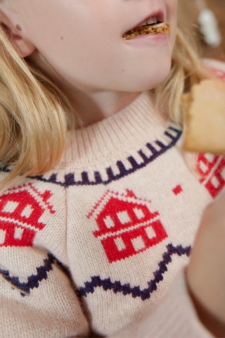 Pull en laine mélangée à manches longues. 
Beige