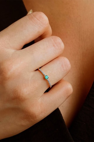 Bague - Or blanc, topazes et émeraude