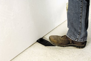 Levantador de placas com gancho de tração