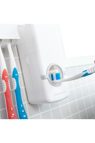 Distribuidor de pasta de dentes com porta-escovas de dentes