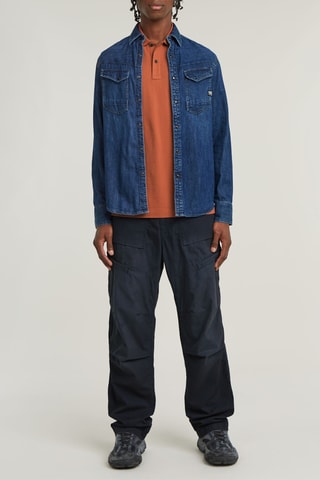 Polo slim in cotone bio Dunda - Rosso mattone