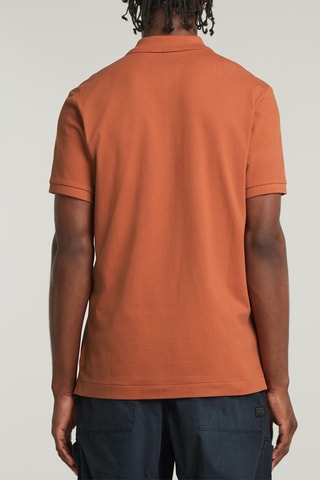 Polo slim en coton biologique Dunda - Rouge brique