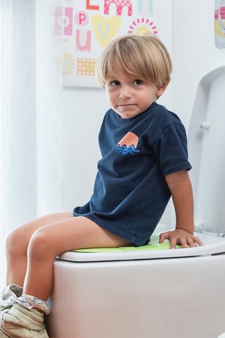 Sedile riduttore pieghevole per WC