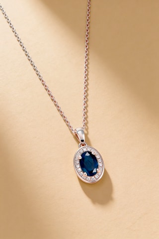 Colgante Lara - Oro blanco, diamantes y zafiro