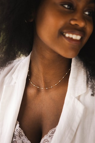 Vela perfumada e colar Vanille Gourmande - Bege e dourado