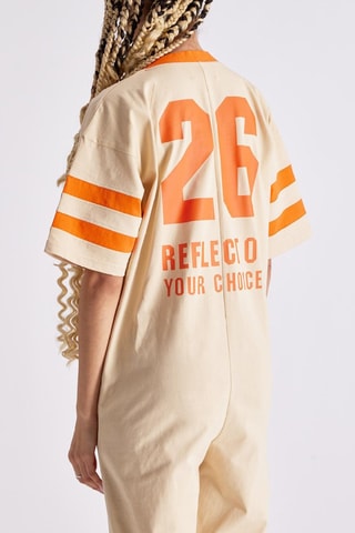 Mono Nora - Crudo y naranja