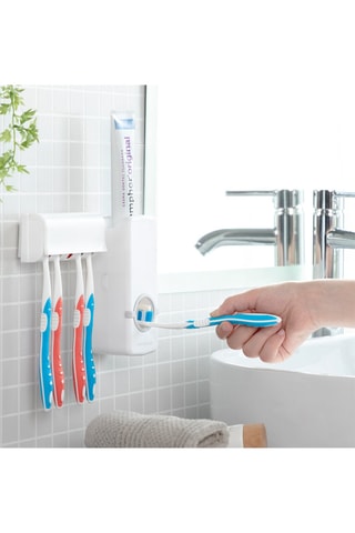 Dispensador de dentífrico con soporte para cepillos de dientes