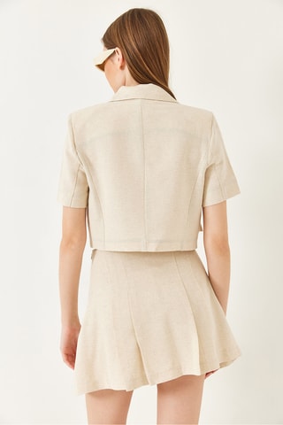 Casaco curto e minissaia plissada de cintura subida - Bege