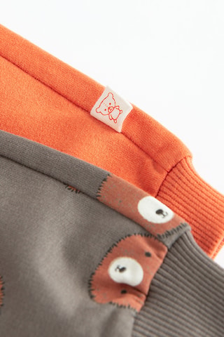 2 joggings - Gris et orange