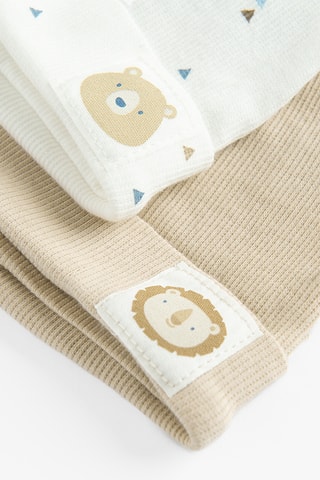 2 bonnets à oreilles - Beige et blanc