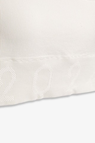 Top sportivo asimmetrico Capsule Active - Bianco