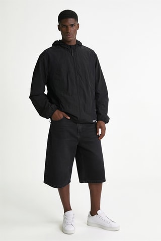 Cortavientos de running con capucha - Negro