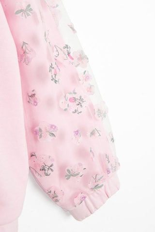Sweater van 2 materialen. Roze