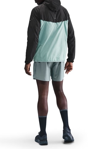 Coupe-vent de running à capuche Stride - Noir et turquoise