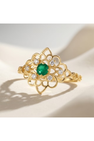 Bague - Or jaune, topazes et émeraude