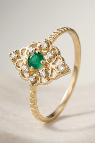Bague - Or jaune, topazes et émeraude