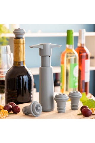 Tire-bouchon à pompe et 4 bouchons de vin